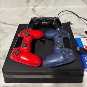 PlayStation 4 with 3 controllers and games
